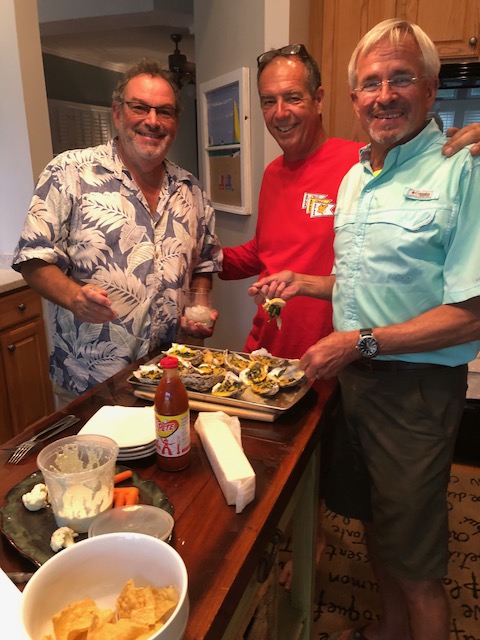 Three oyster shuckers